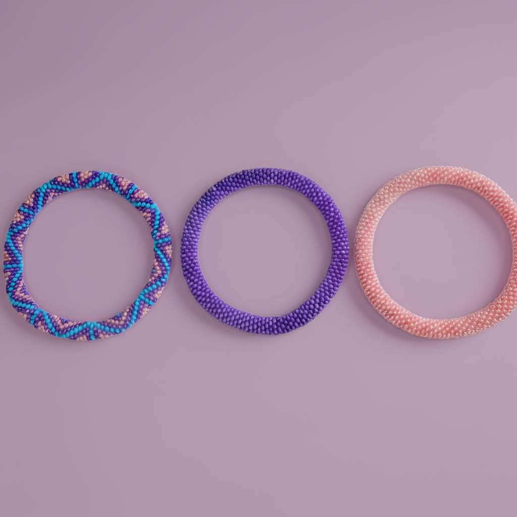Three beaded bracelets in blue, purple, and pink on a purple background - Beadzy