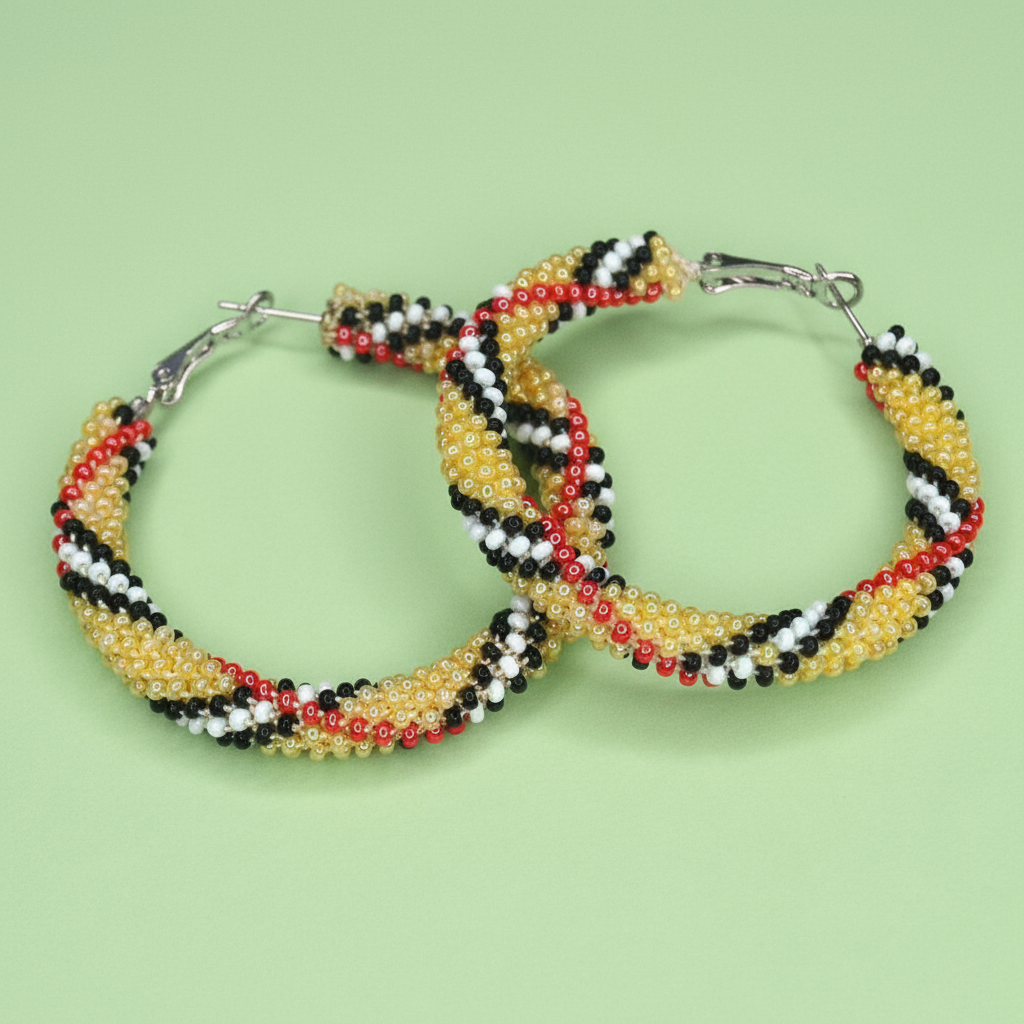 Beaded hoop earrings with a colorful pattern on a green background - Beadzy