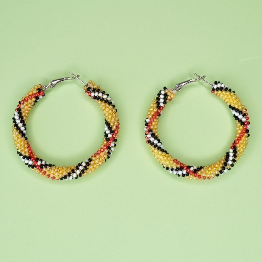 Beaded hoop earrings on a light green background - Beadzy