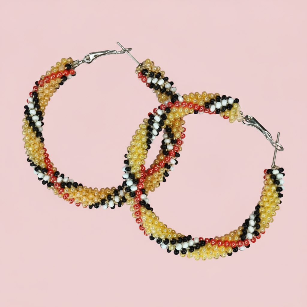 Beaded hoop earrings on a pink background - Beadzy