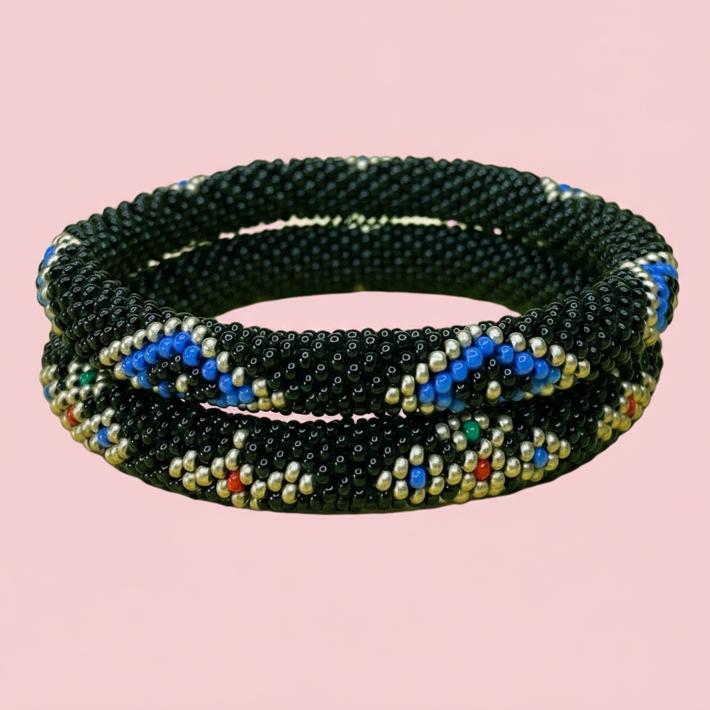 Black beaded bracelet with Evil eye accents on a pink background - Beadzy