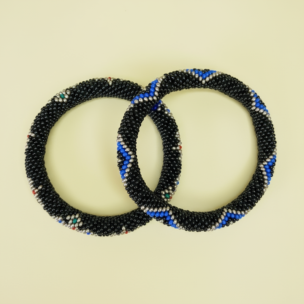 Two beaded bracelets with black, blue, and evil eye pattern on a beige background - Beadzy