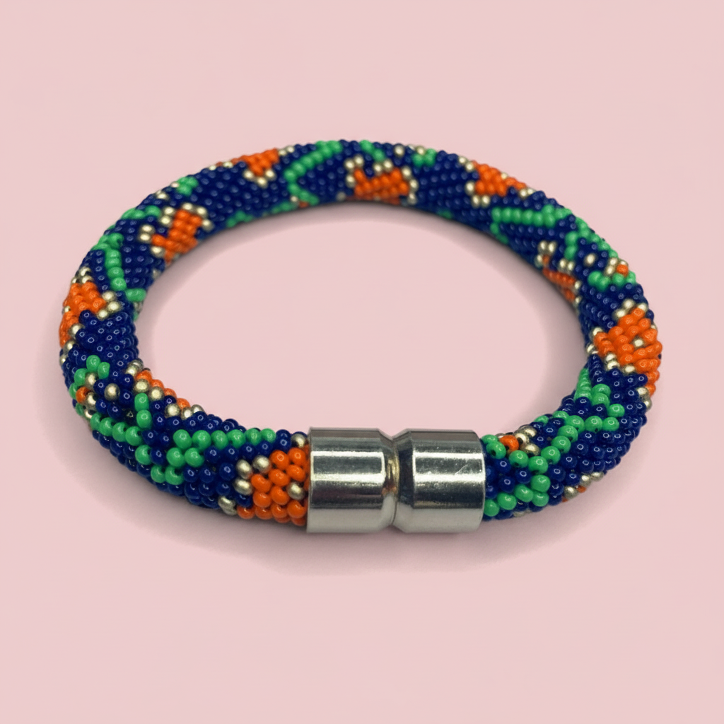 Beaded bracelet with a metallic clasp on a pink background - Beadzy