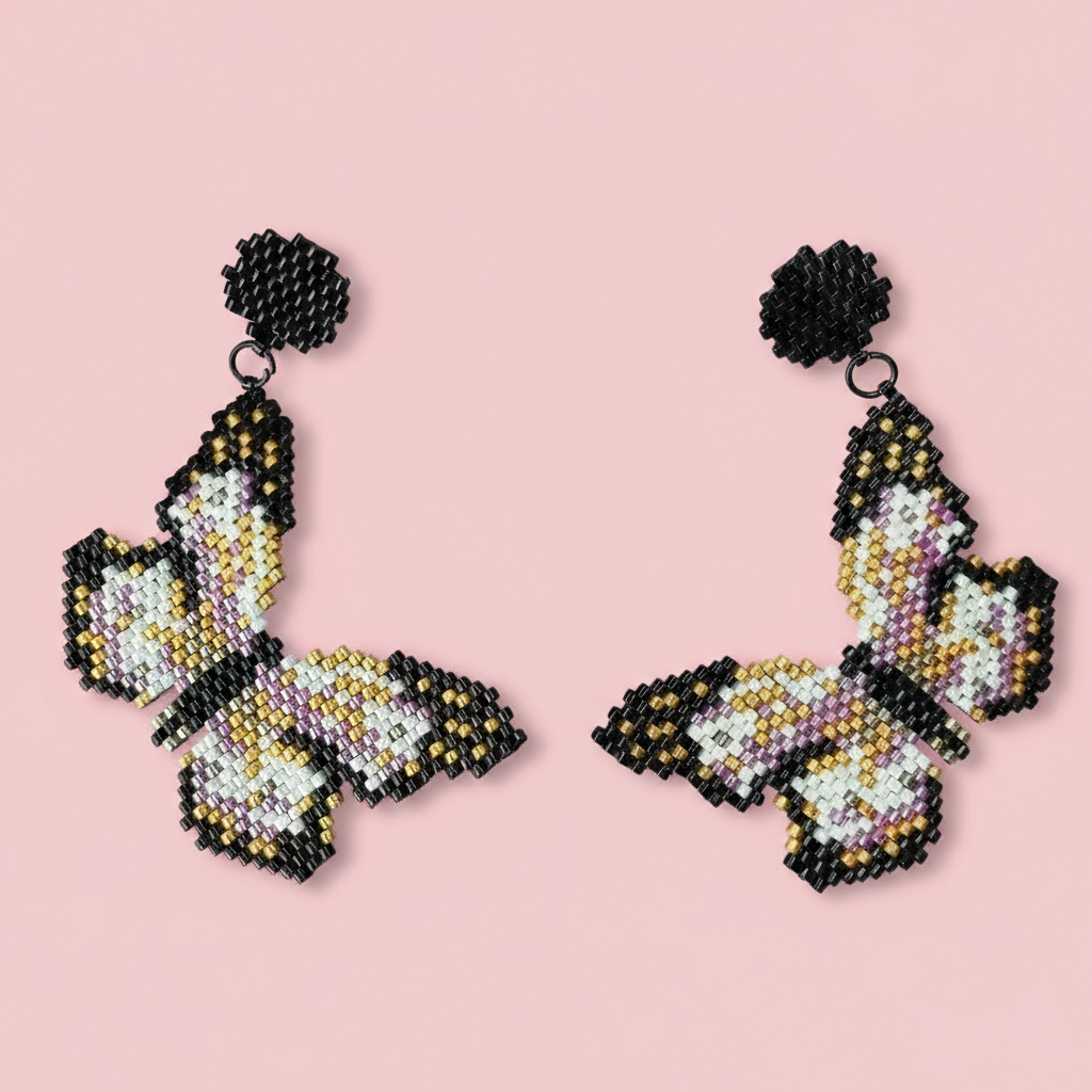 Butterfly-shaped earrings made of beads on a pink background - Beadzy