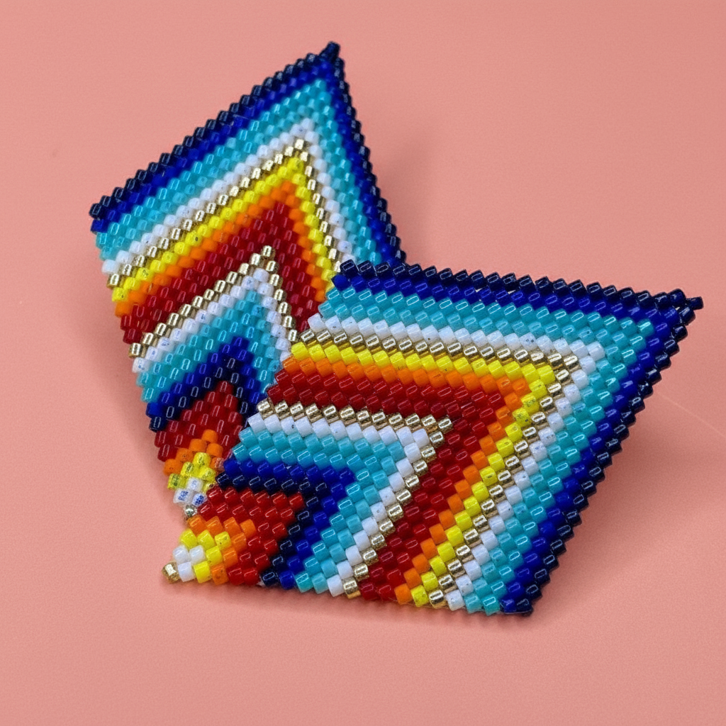 Rainbow color beaded diamond-shaped earrings on a pink background - Beadzy