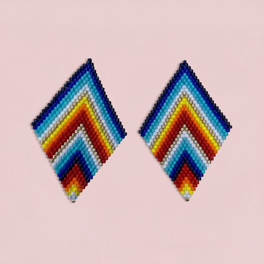 Pair of rainbow color beaded earrings on a pink background - Beadzy