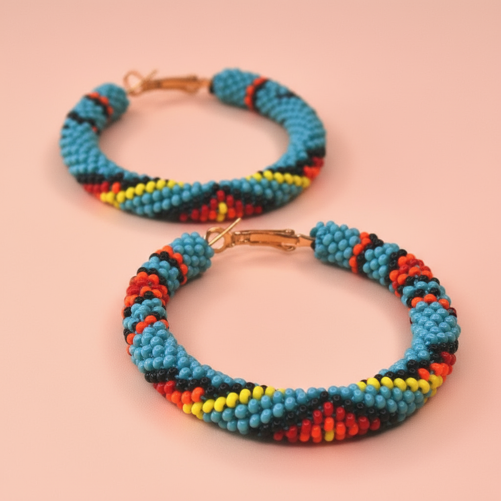 Colorful beaded hoop earrings on a pink background - Beadzy