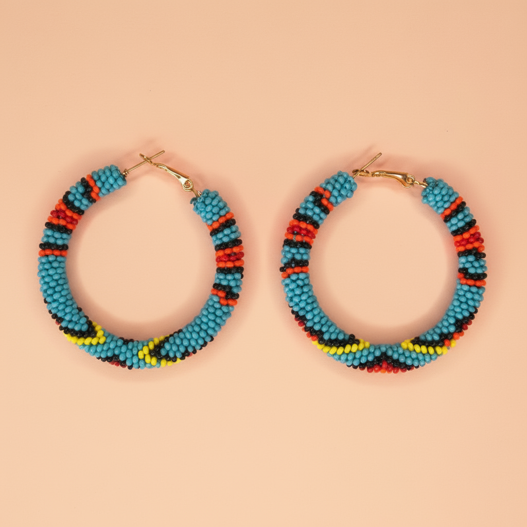 Colorful tribal beaded hoop earrings on a beige background - Beadzy
