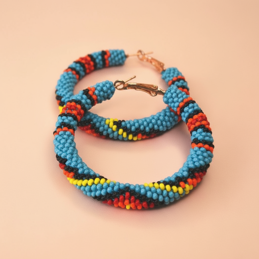 Colorful beaded hoop earrings on a beige background - Beadzy