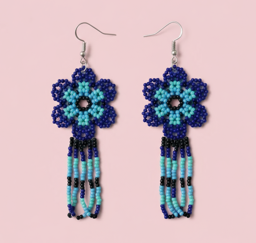 Beaded blue flower earrings on a pink background - Beadzy