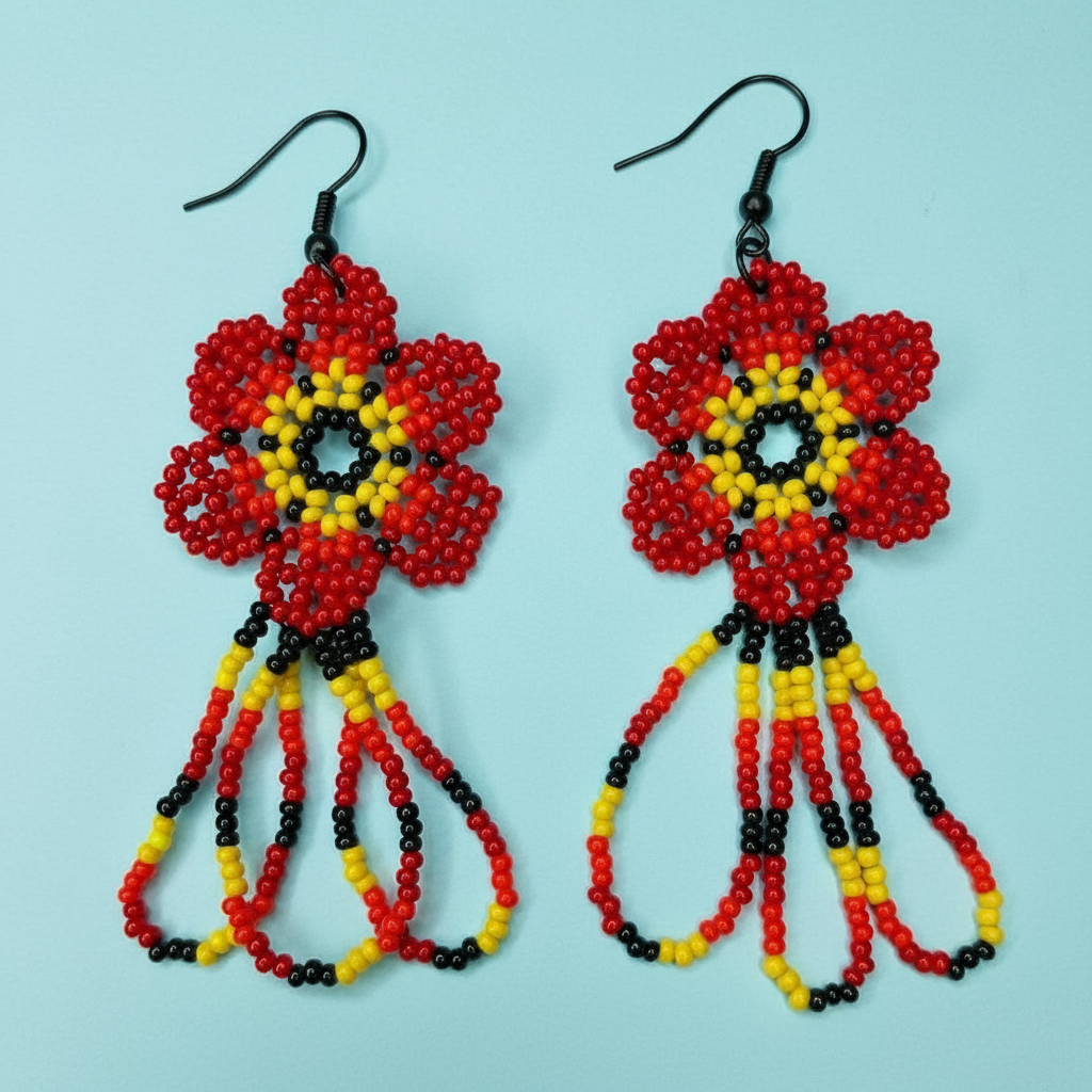 Pair of beaded earrings with red, yellow, and black on a light blue background - Beadzy