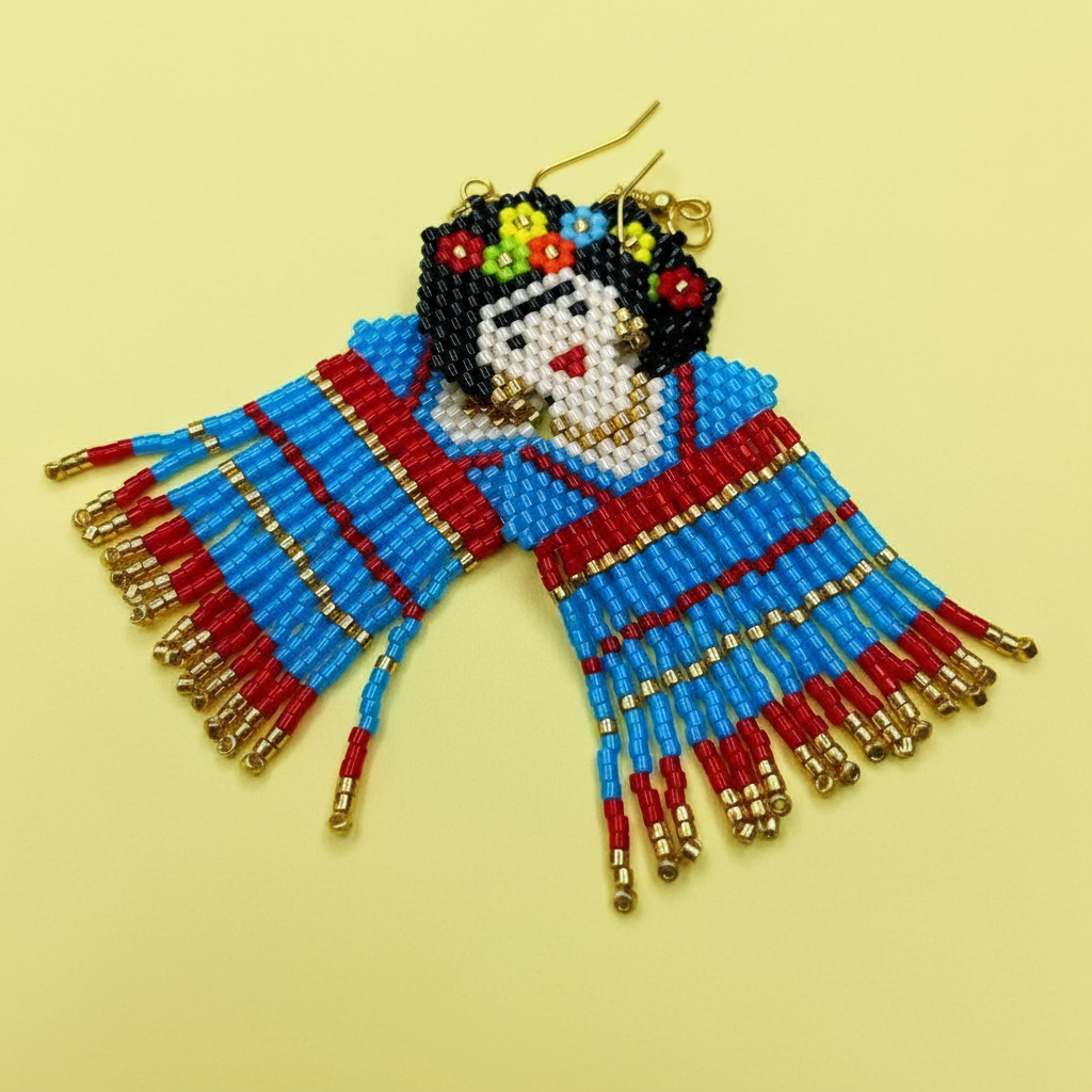 Colorful beaded earrings shaped like a Frida on a yellow background - Beadzy