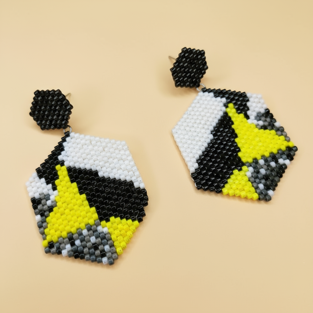 Hexagonal beaded earrings with black, yellow, and gray pattern on a beige background - Beadzy
