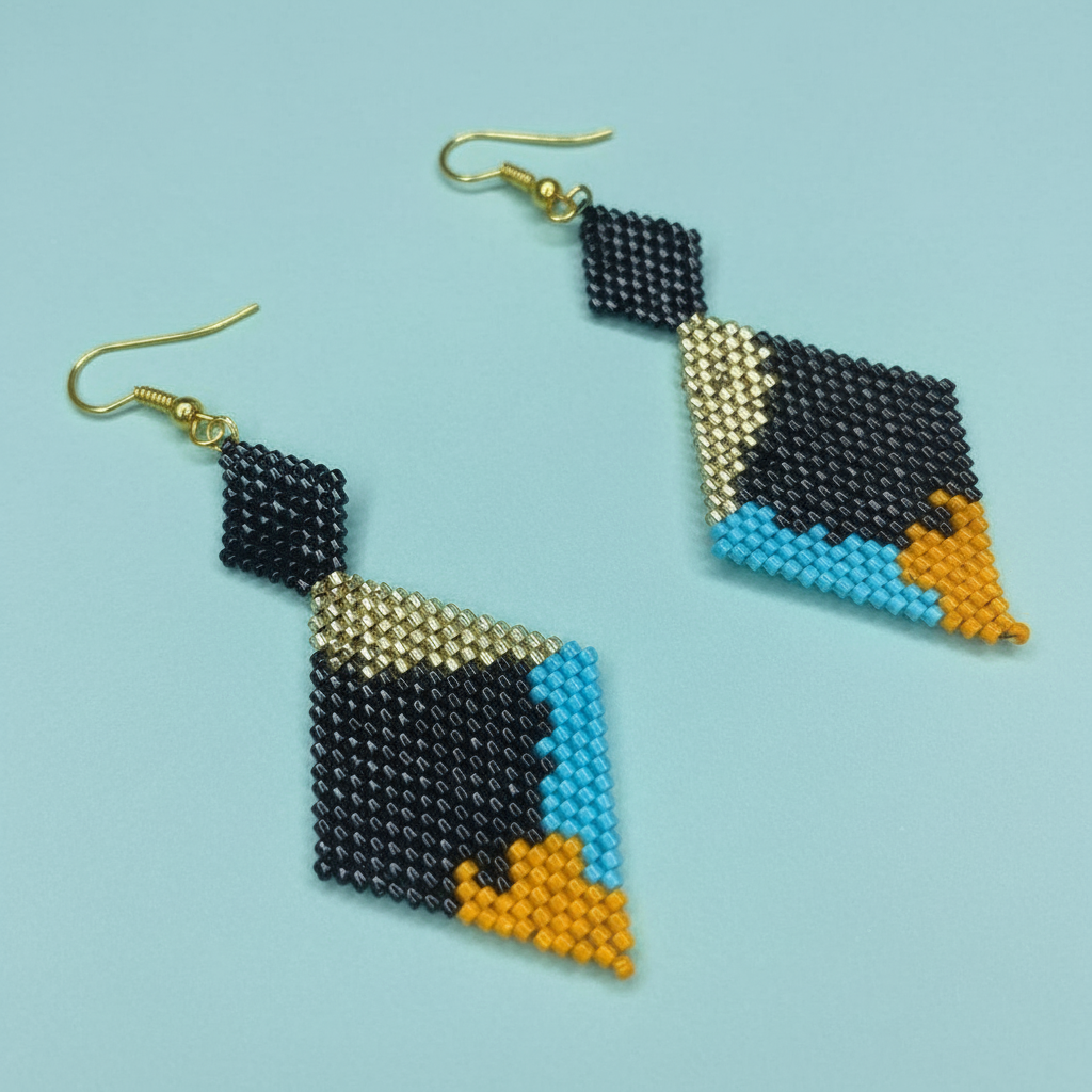 Geometric beaded earrings on a light blue background - Beadzy 