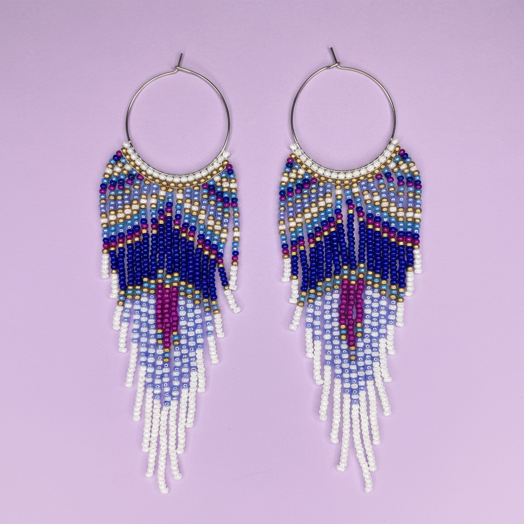 Beaded earrings with colorful fringe on a purple background - Beadzy
