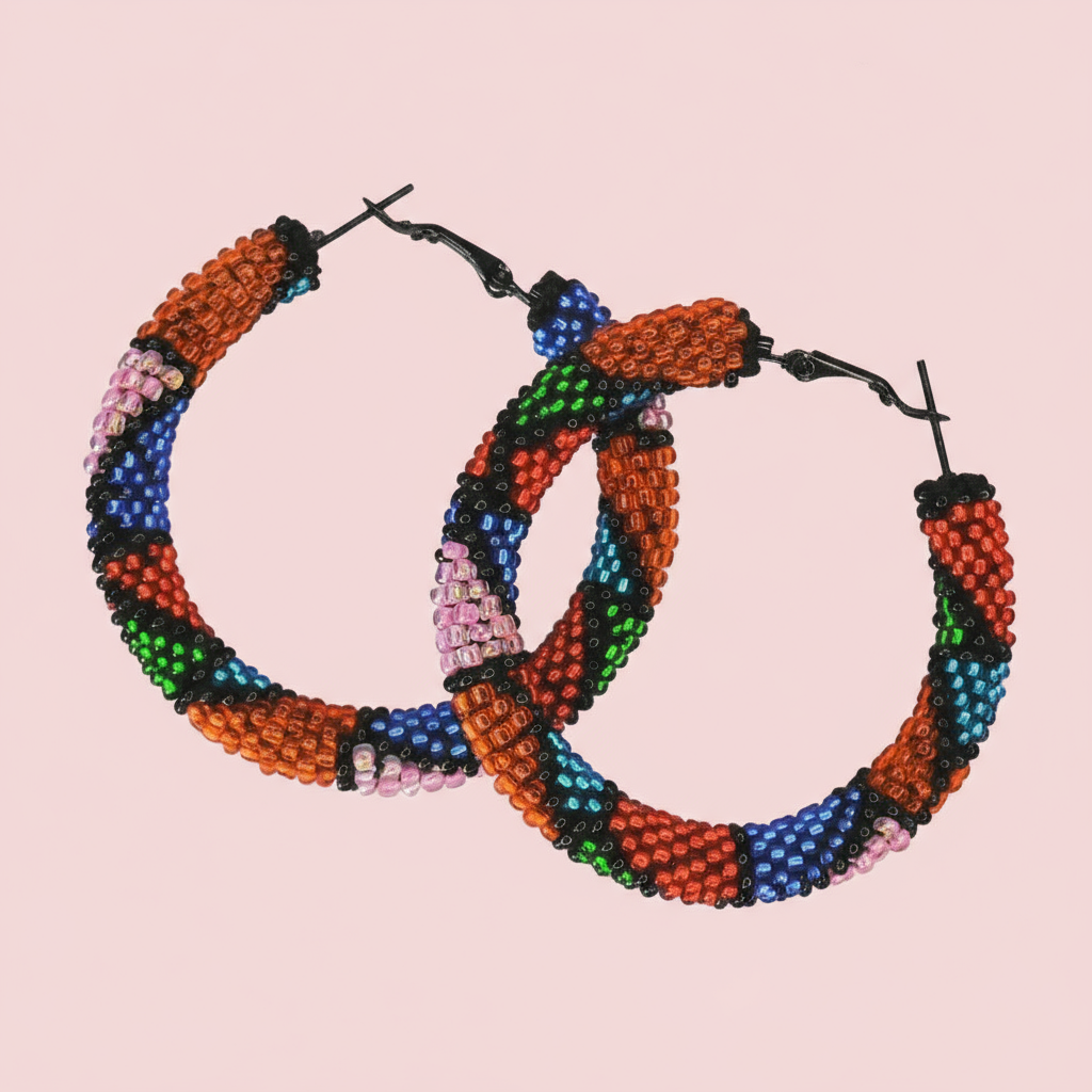 Colorful beaded hoop earrings on a pink background - Beadzy
