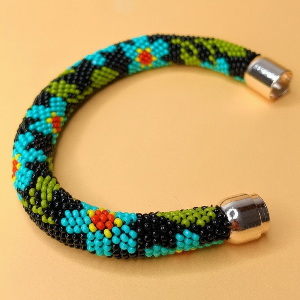 Colorful beaded bracelet with metallic clasp on a beige background - Beadzy