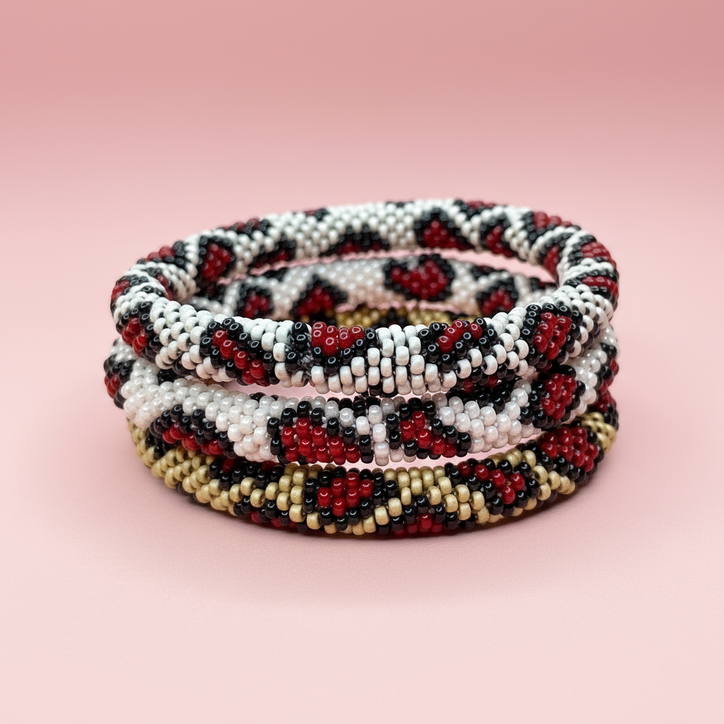 Set of three beaded bracelets with leopard print pattern on a pink background - Beadzy