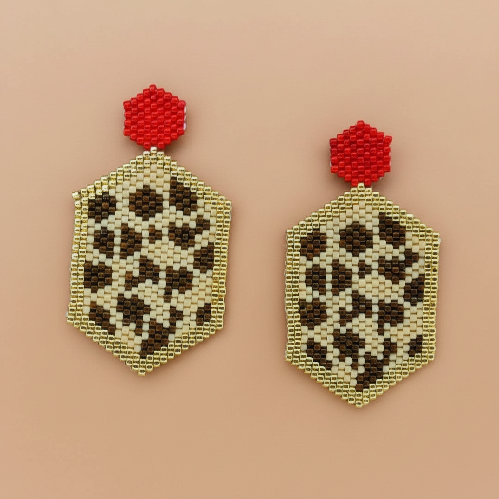 Pair of beaded earrings with red tops and leopard print pattern on a beige background - Beadzy