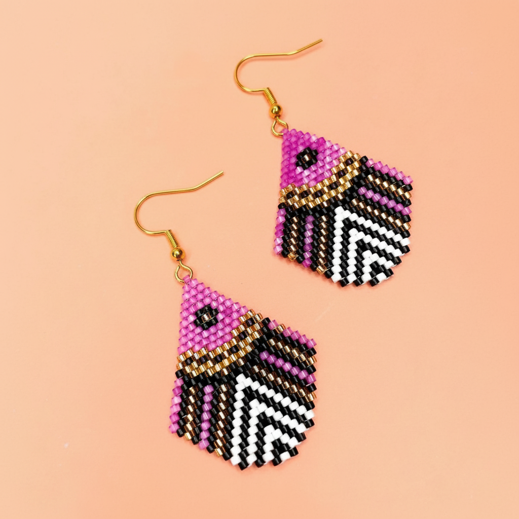 Pair of pink beaded earrings with geometric pattern on a beige background - Beadzy