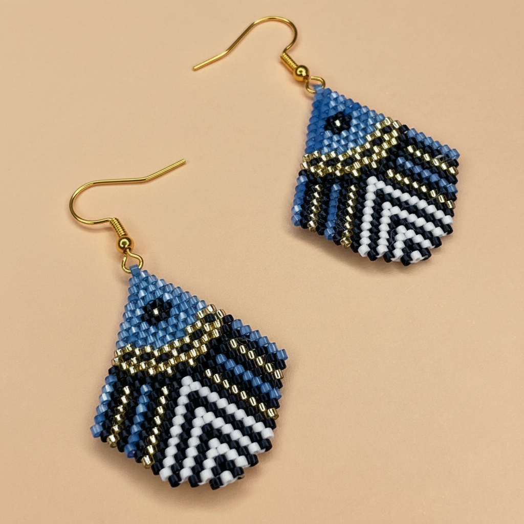Pair of blue geometric beaded earrings on a beige background - Beadzy