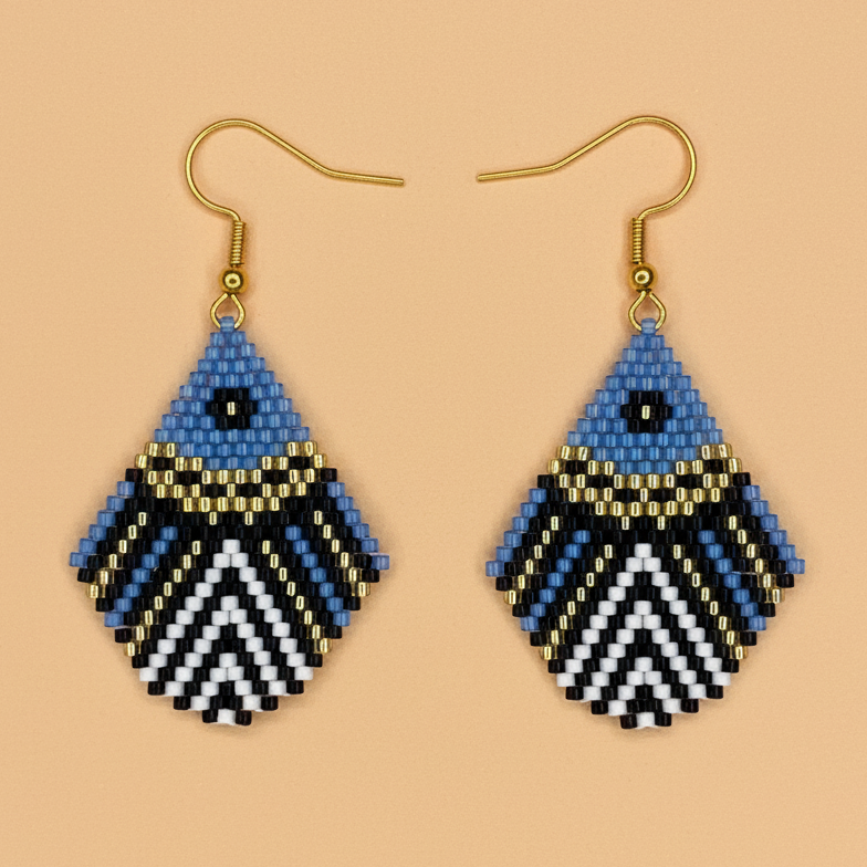Pair of blue beaded earrings with geometric pattern on a orange background - Beadzy