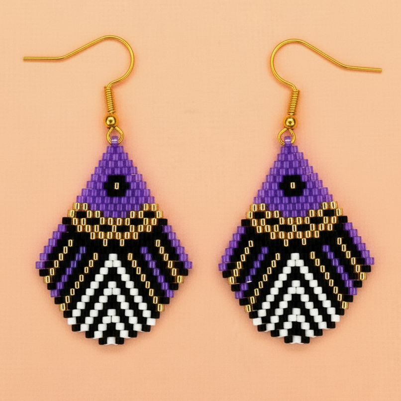 Pair of purple beaded earrings with geometric pattern on a beige background - Beadzy