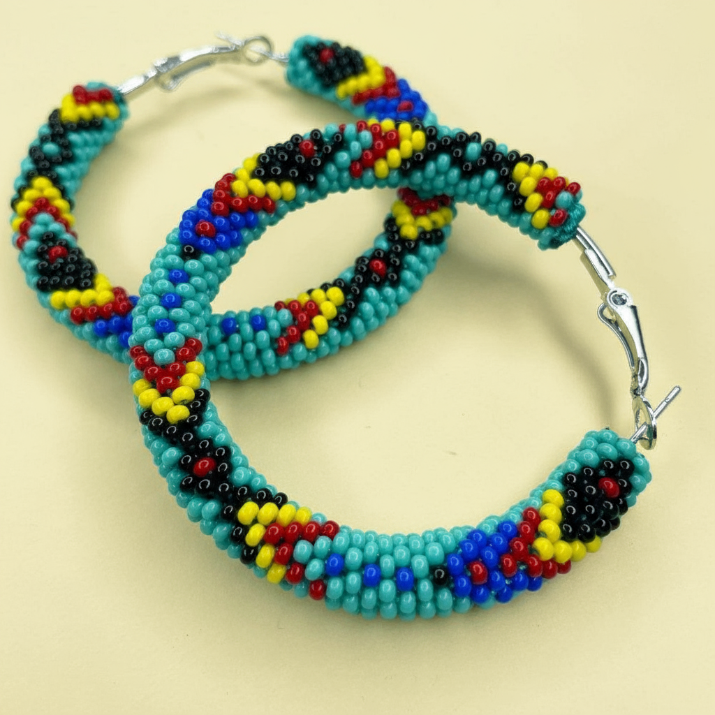 Colorful beaded hoop earrings on a beige background - Beadzy