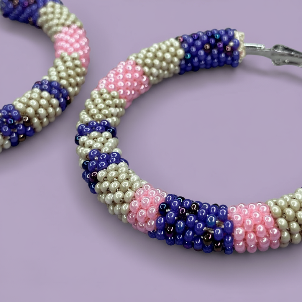 Beaded hoop earrings with pink, blue, and white pattern on a purple background - Beadzy