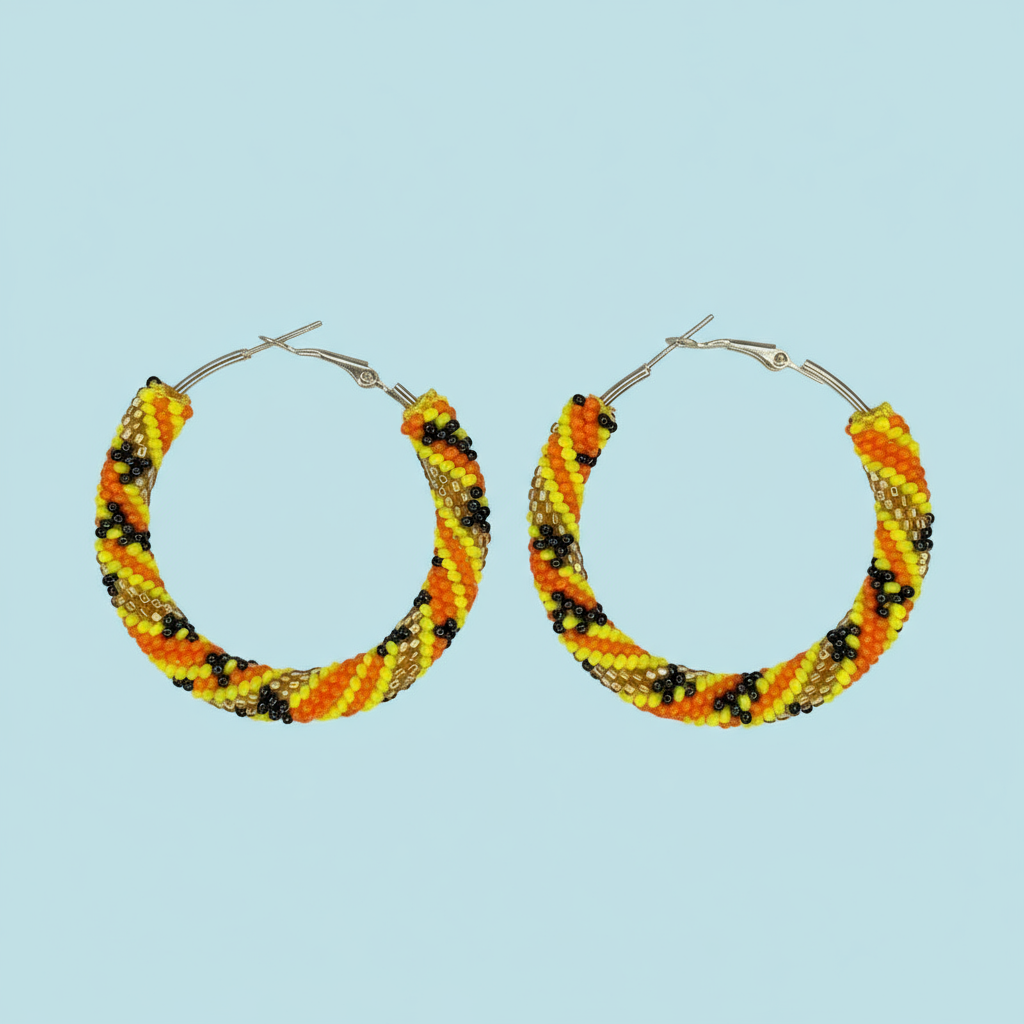 Pair of yellow beaded hoop earrings on a light blue background - Beadzy