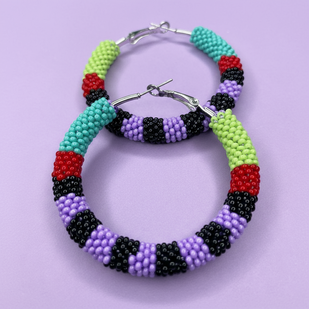 Colorful beaded hoop earrings on a light purple background - Beadzy