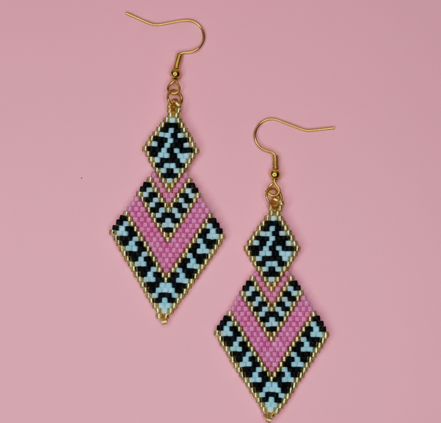 Geometric patterned pink earrings on a pink background - Beadzy