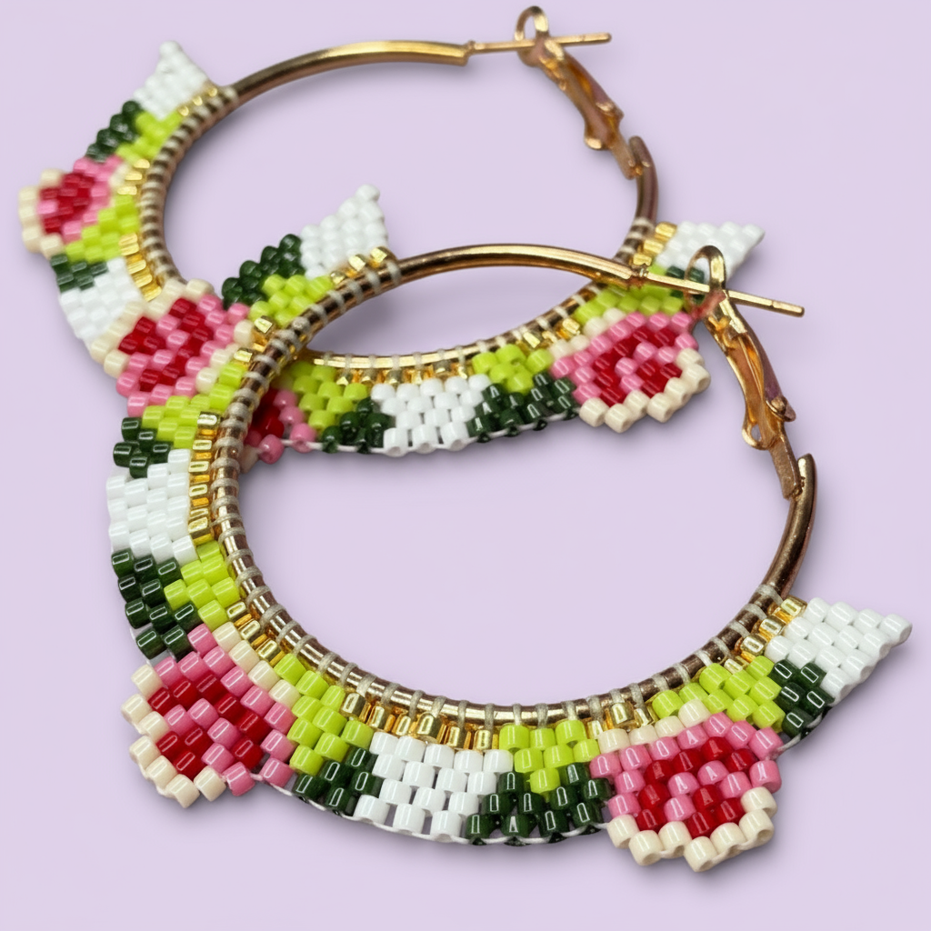 Colorful beaded hoop earrings on a light purple background - Beadzy