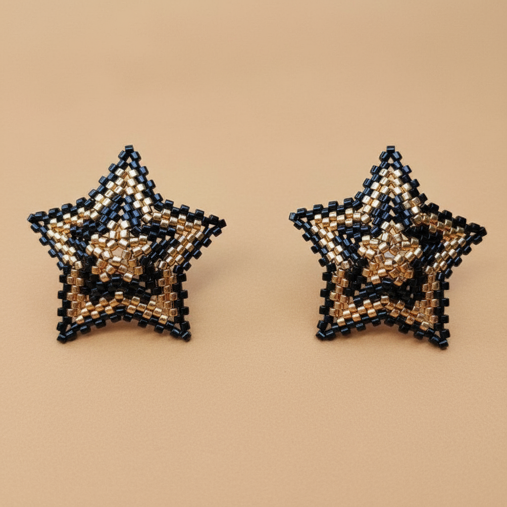 Star-shaped earrings with black and gold beads on a beige background - Beadzy