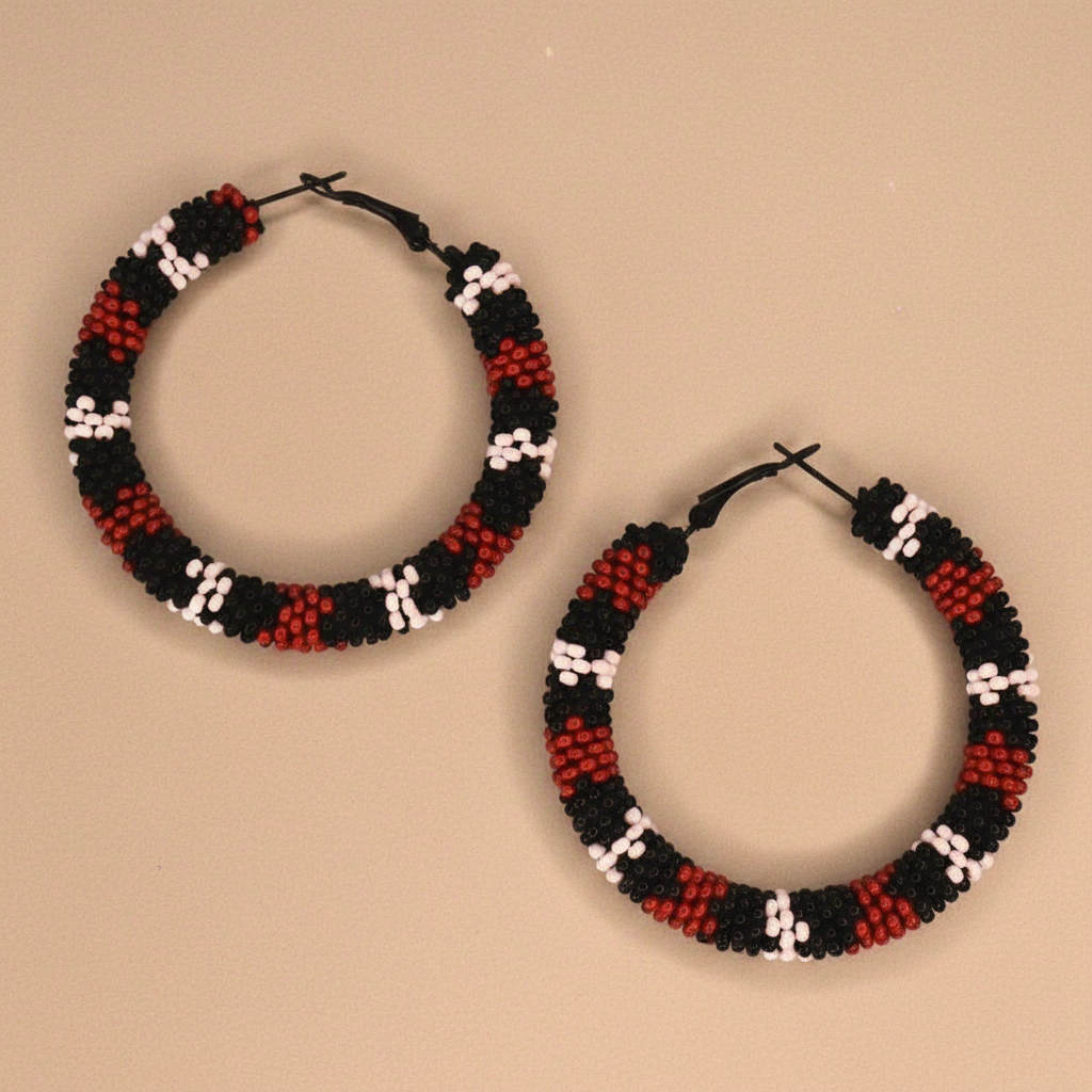 Pair of beaded hoop earrings on a beige background - Beadzy