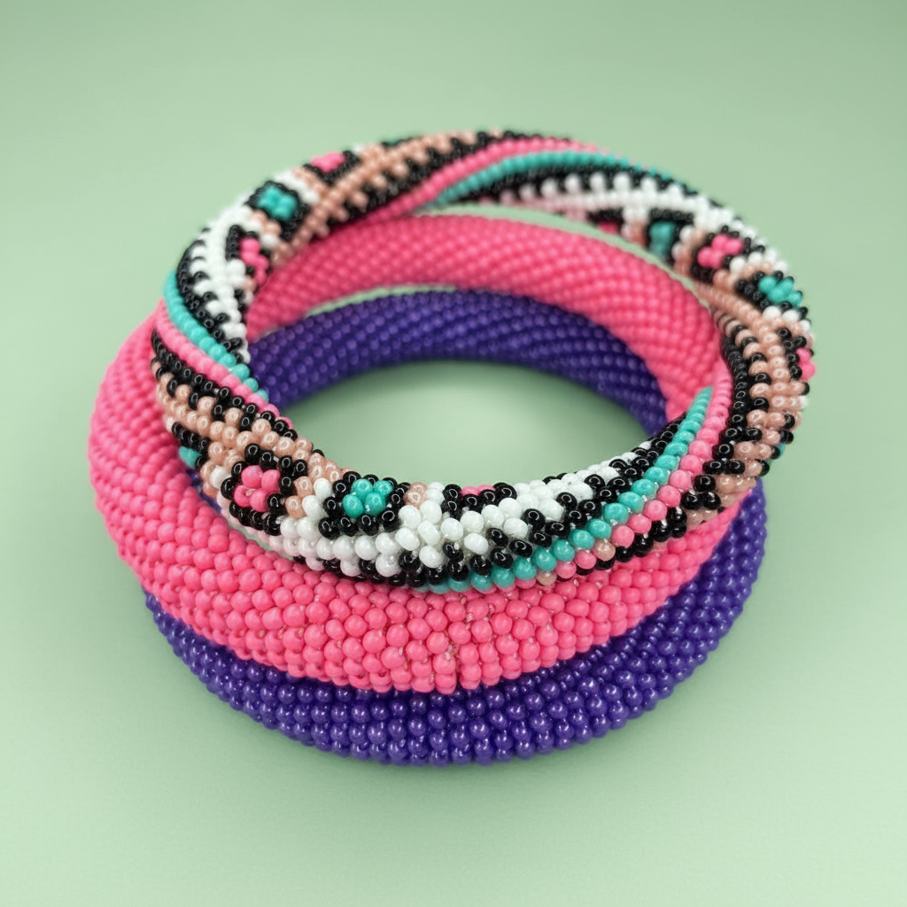 Stack of colorful beaded rope bracelets on a light green background - Beadzy