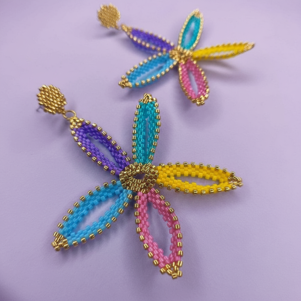 Colorful beaded flower earrings on a purple background - Beadzy