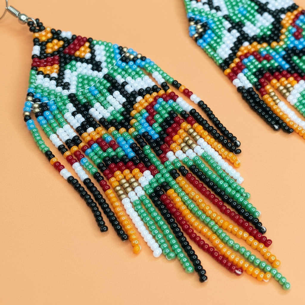 Colorful green beaded earrings on a beige background - Beadzy