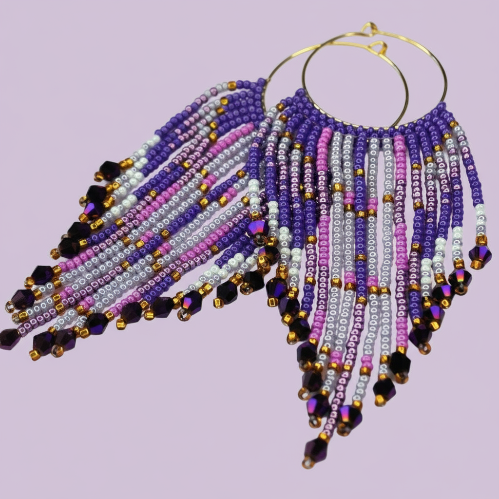 Beaded earrings with purple, pink, and gold beads on a light purple background - Beadzy