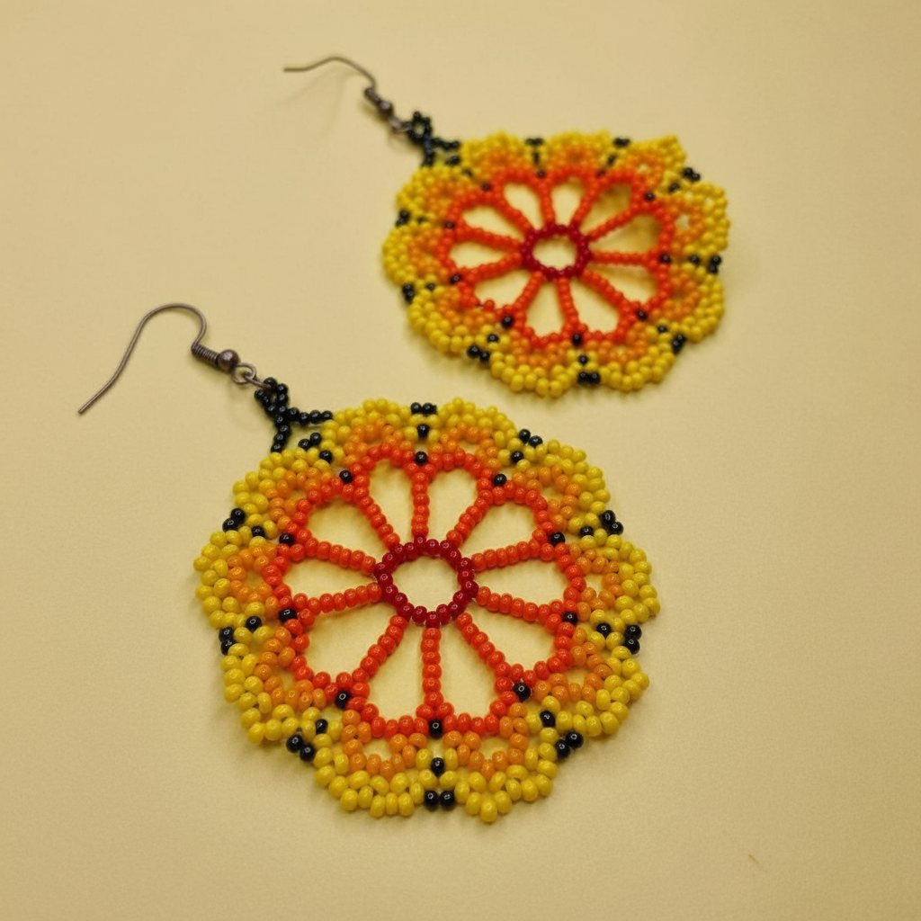Pair of beaded earrings with a circular design on a beige background - Beadzy
