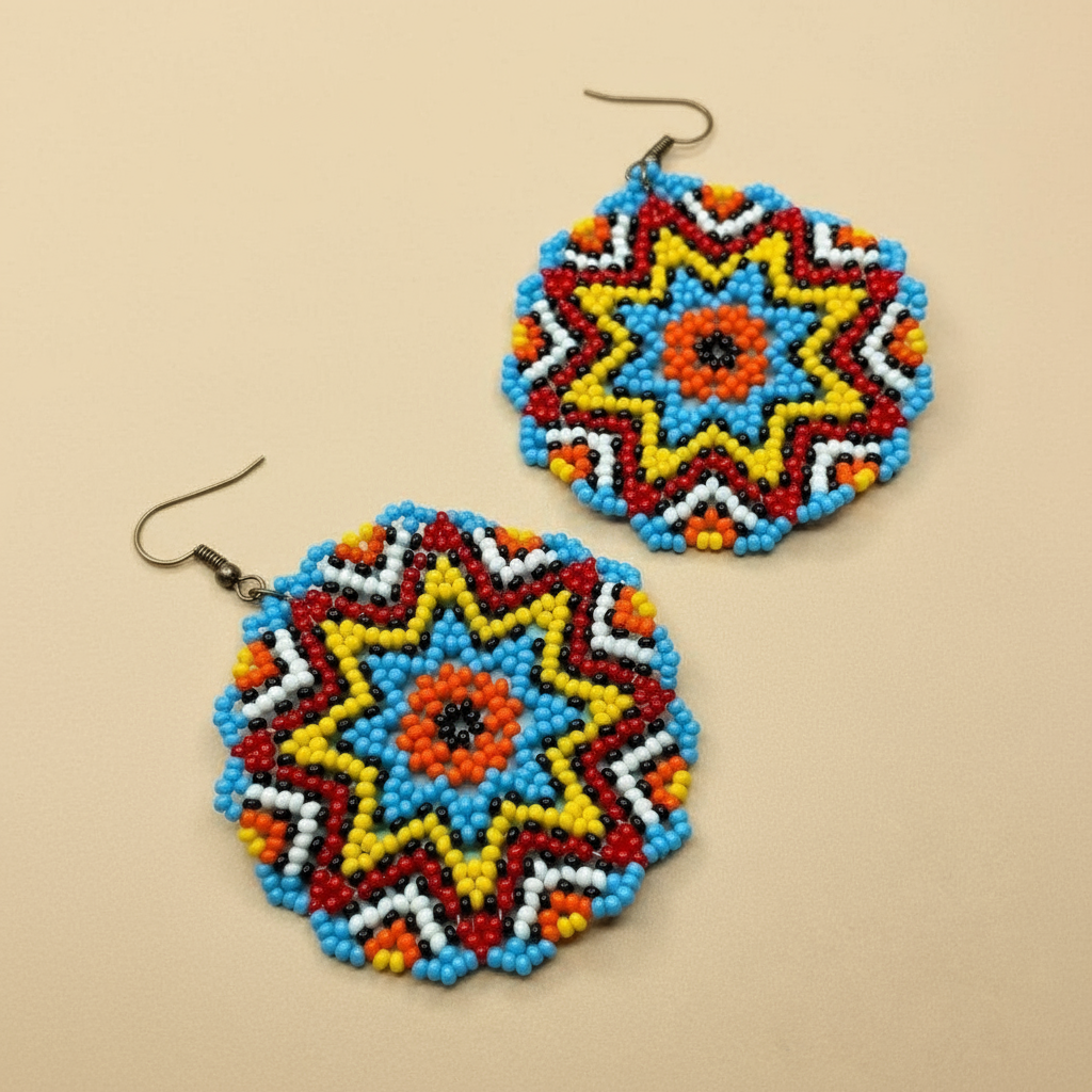 Colorful beaded earrings on a beige background